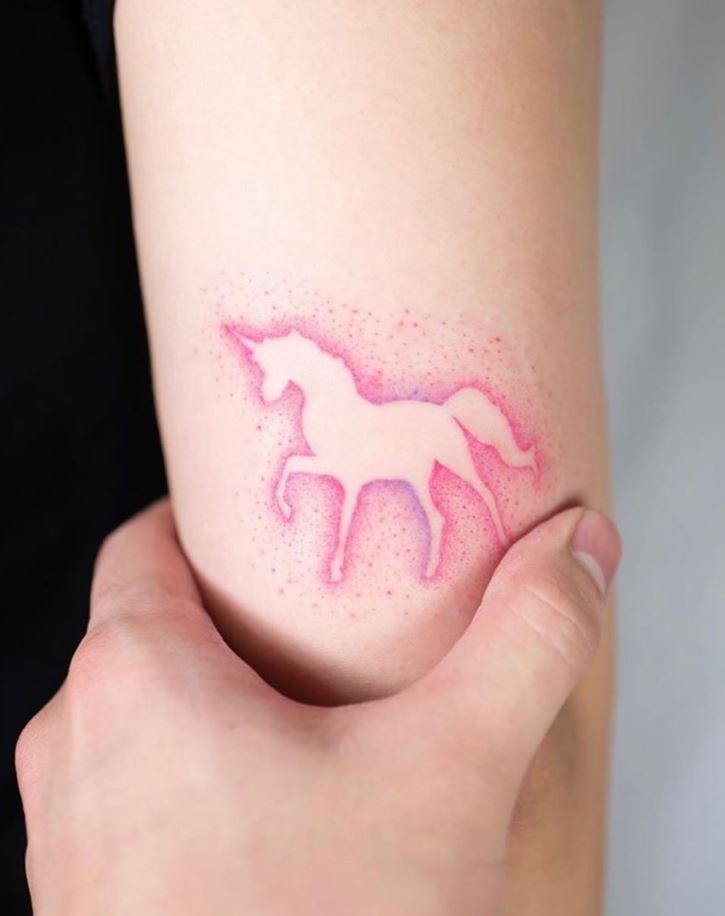 Glowing Pink Unicorn Tattoo