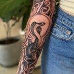 Black And Gray Arm Tattoo