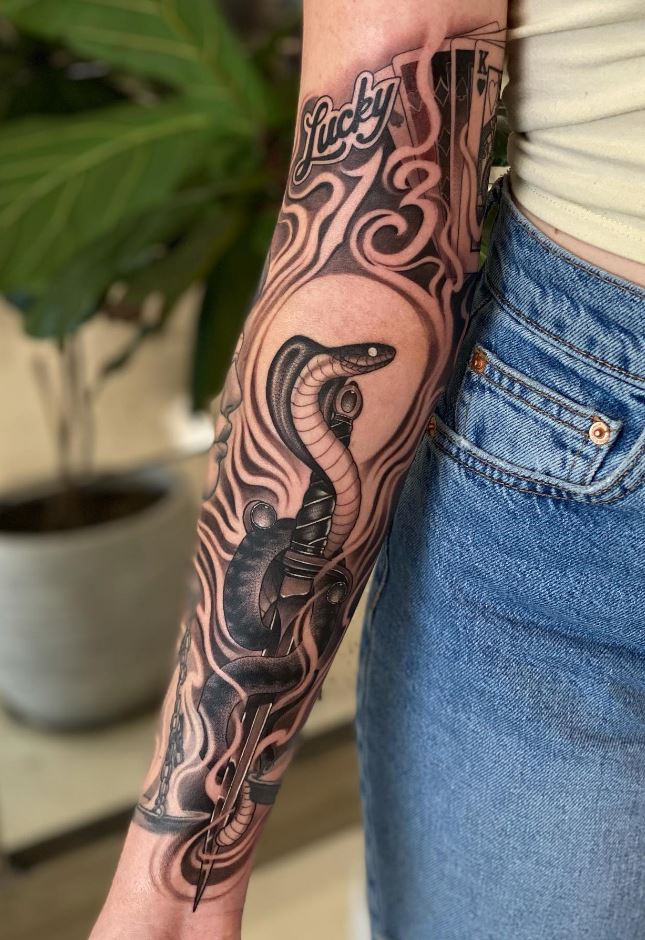 Black And Gray Arm Tattoo